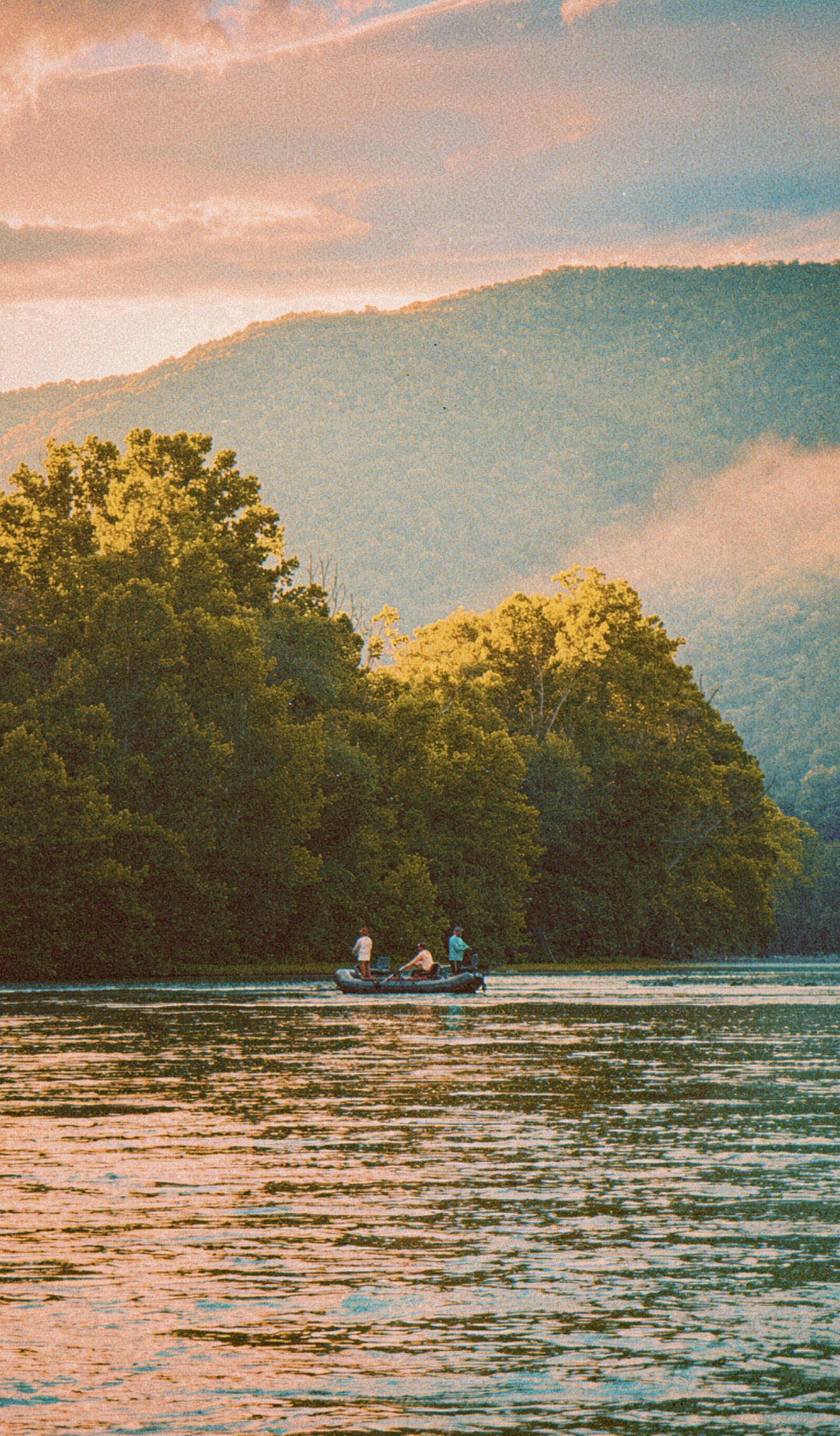 Fishing a river at golden hour in the mountains
